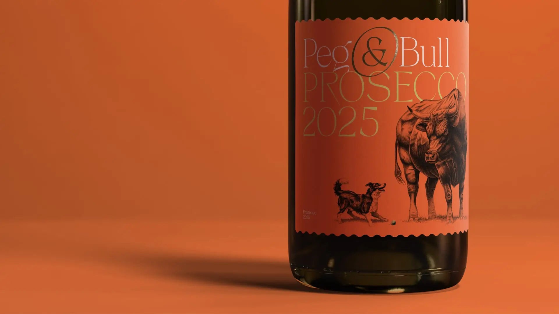 Bottle of Peg & Bull Prosecco 2025 with a label featuring a dog and bull illustration on an orange background.
